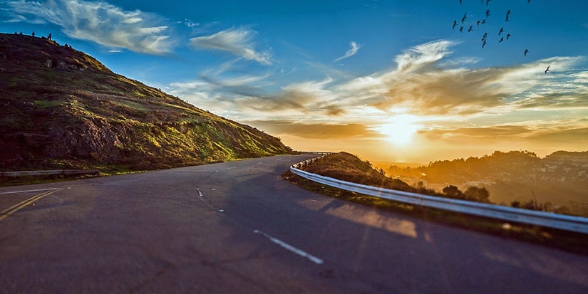 Beautiful sunset over a winding mountain highway
