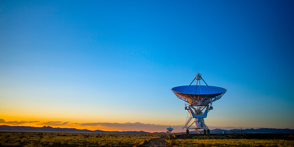 Image of a radio telescope representing the importance of using technology