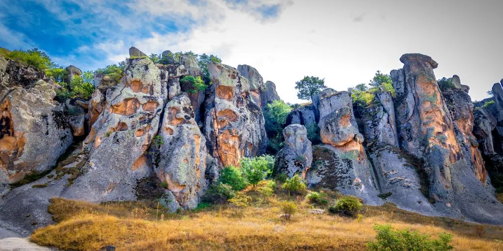 Cliff rising up to sky